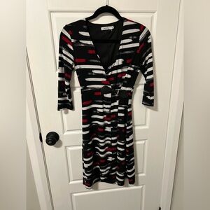 Gorgeous Ricki’s patterned wrap dress with leather buckle